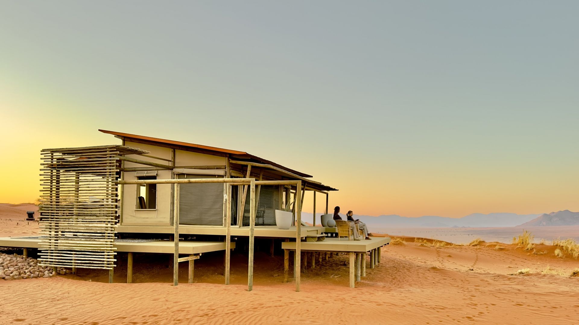 Wolwedans collection desert lodge exterior relaxing on deck yellow